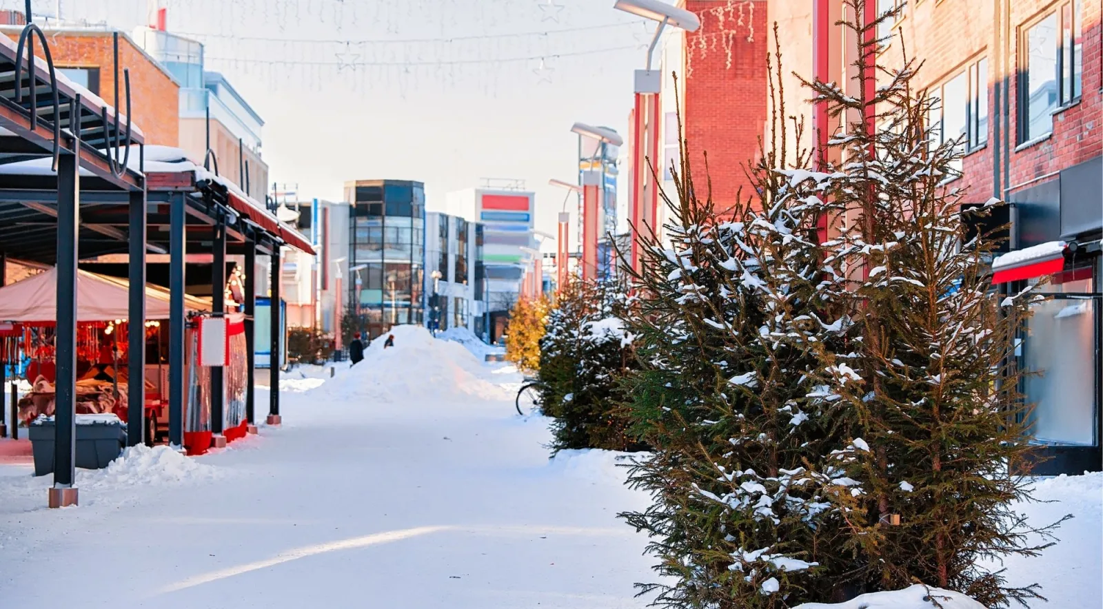 Snowy pedestrian street in central Rovaniemi in winter